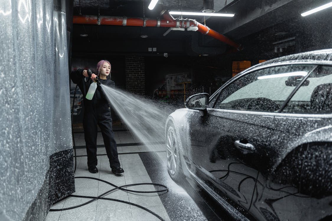 pressure washing a car